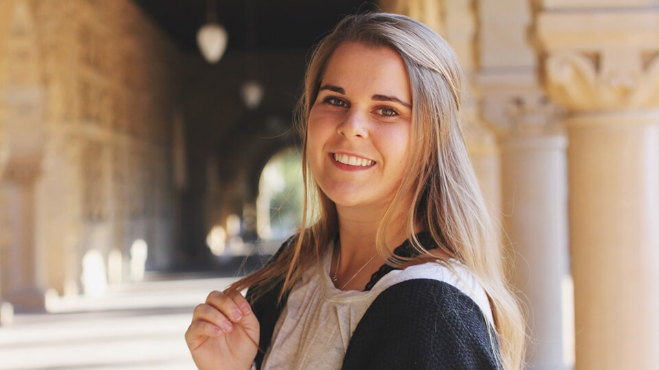 One american postgraduate student smiling at camera